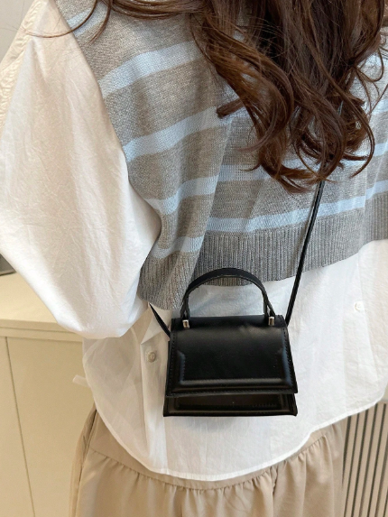 Elegant small handbag in solid color