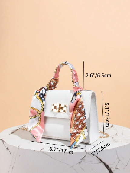 Printed faux leather bag with a chain and scarf detail