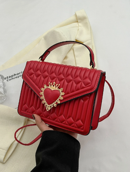 Quilted square bag with crown and heart embellishment