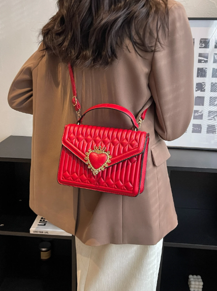 Quilted square bag with crown and heart embellishment